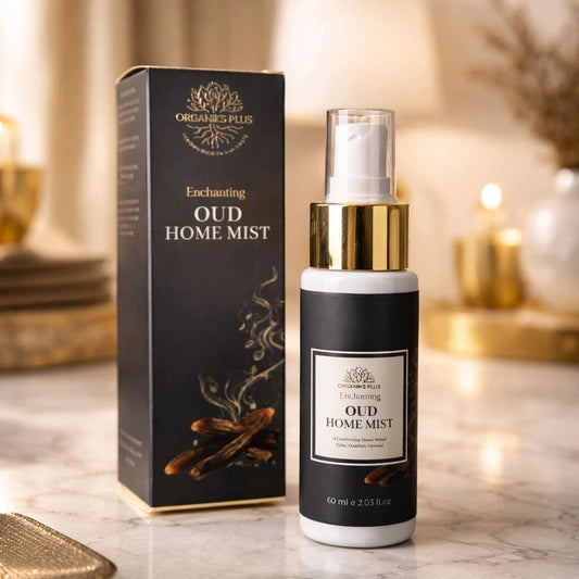 Organiks Plus Oud home mist bottle and packaging on a marble surface with candles in the background